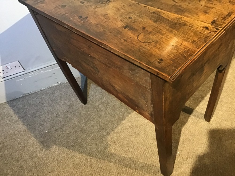 An 18th-century style antique walnut lowboy table featuring three drawers with decorative brass handles and fretwork corner brackets. View X
