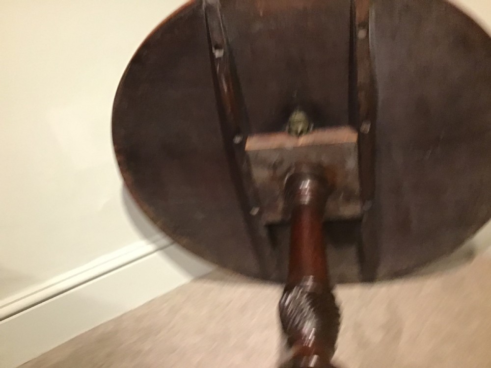 A Georgian mahogany tripod table featuring a smooth circular top supported by a turned central pedestal and three cabriole legs. View VIII