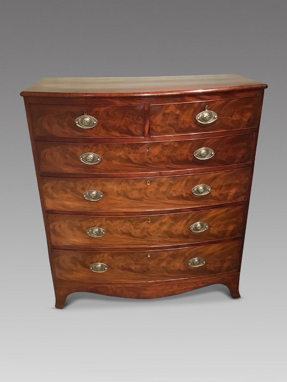Antique mahogany bow front chest of drawers