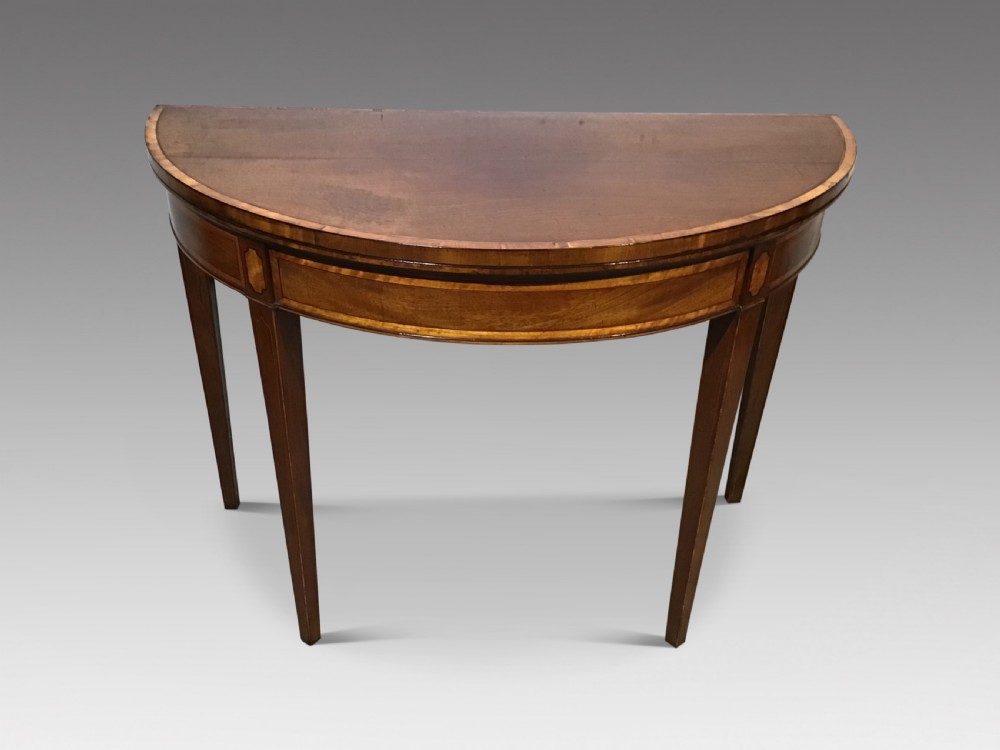 A Geo III mahogany card table