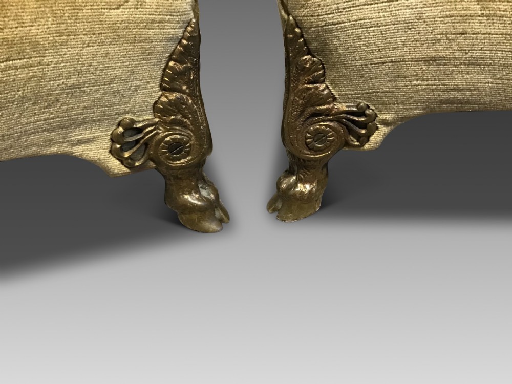 A pair of low rectangular antique footstools upholstered in mustard gold velvet with ornate carved cabriole legs. View II