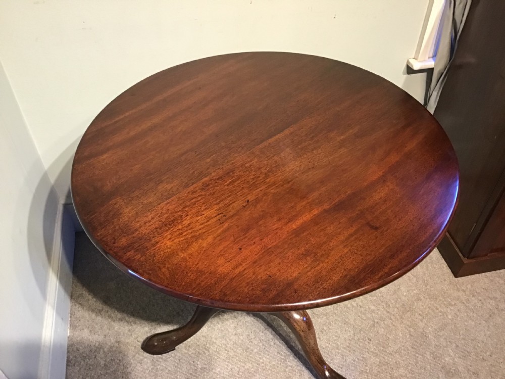 An 18th-century Georgian mahogany tripod table featuring a circular top, a central turned pedestal column, and three splayed cabriole legs. View III