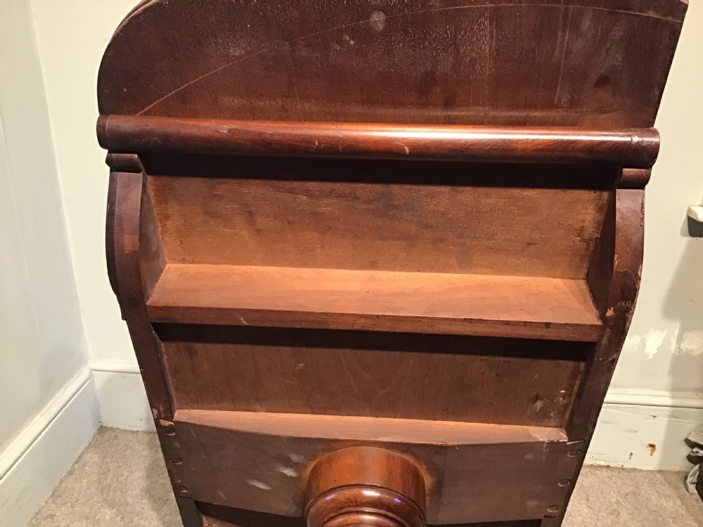 A Regency period flame mahogany fold-over card table featuring a carved pedestal column, a quadruped platform base, and scroll corner brackets. View XVI
