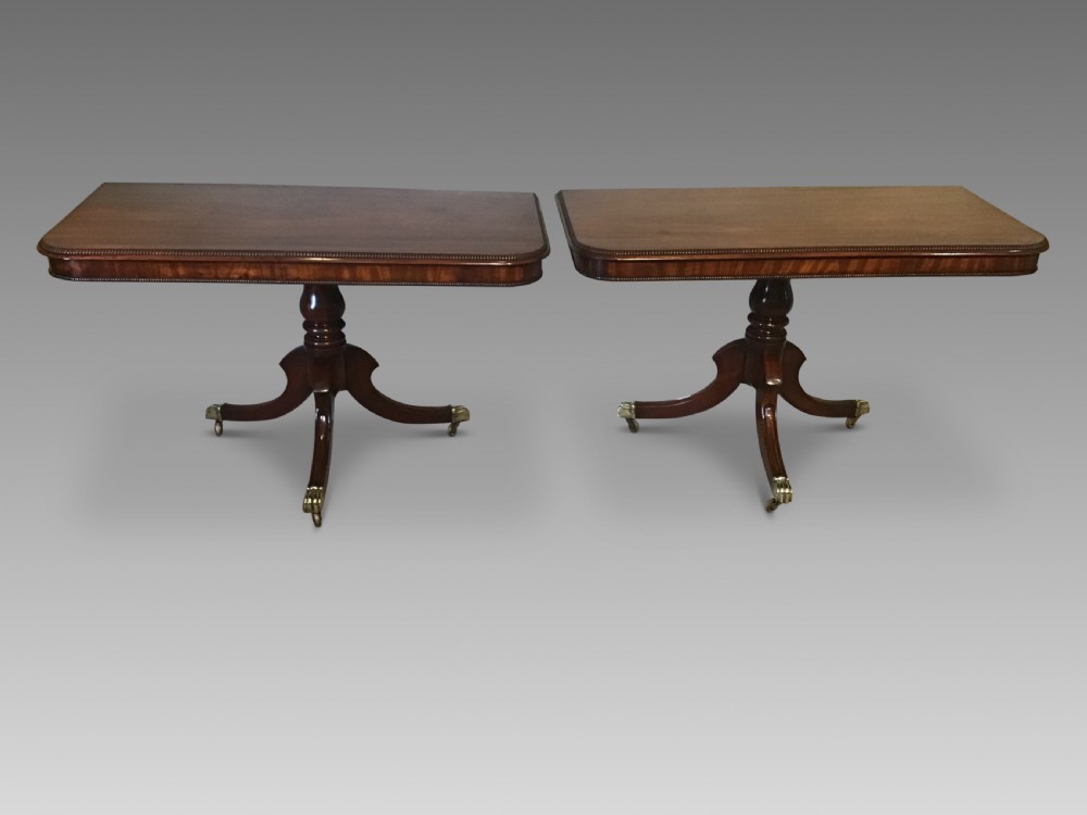 Pair of regency mahogany pedestal sidetables