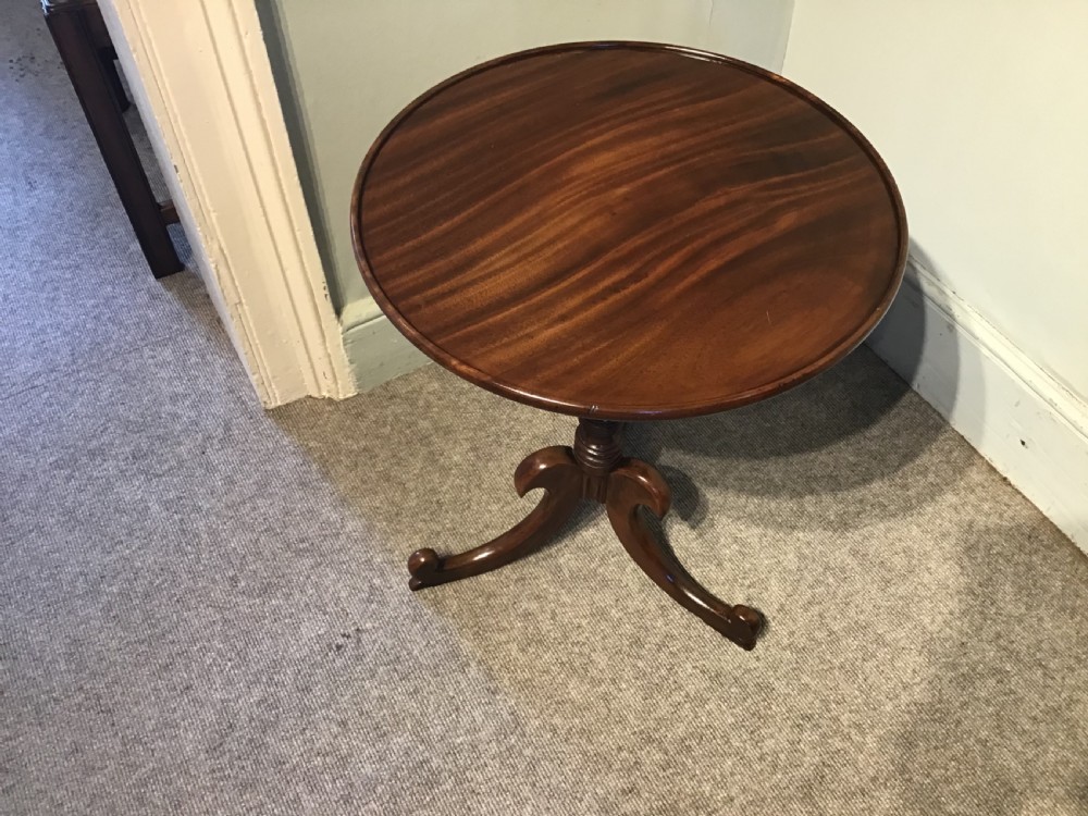An antique mahogany low tripod table View II