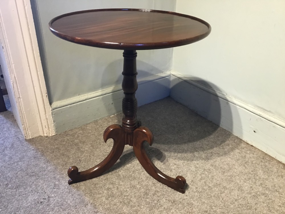 An antique mahogany low tripod table View III