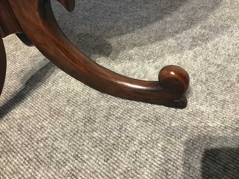 An antique mahogany low tripod table View V