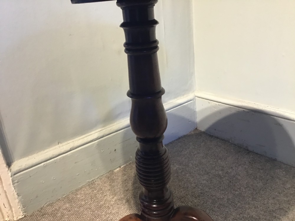 An antique mahogany low tripod table View VII