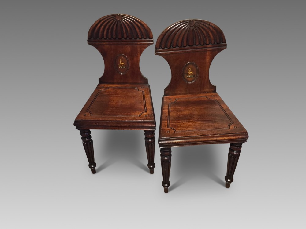 Pair of antique mahogany hall chairs 