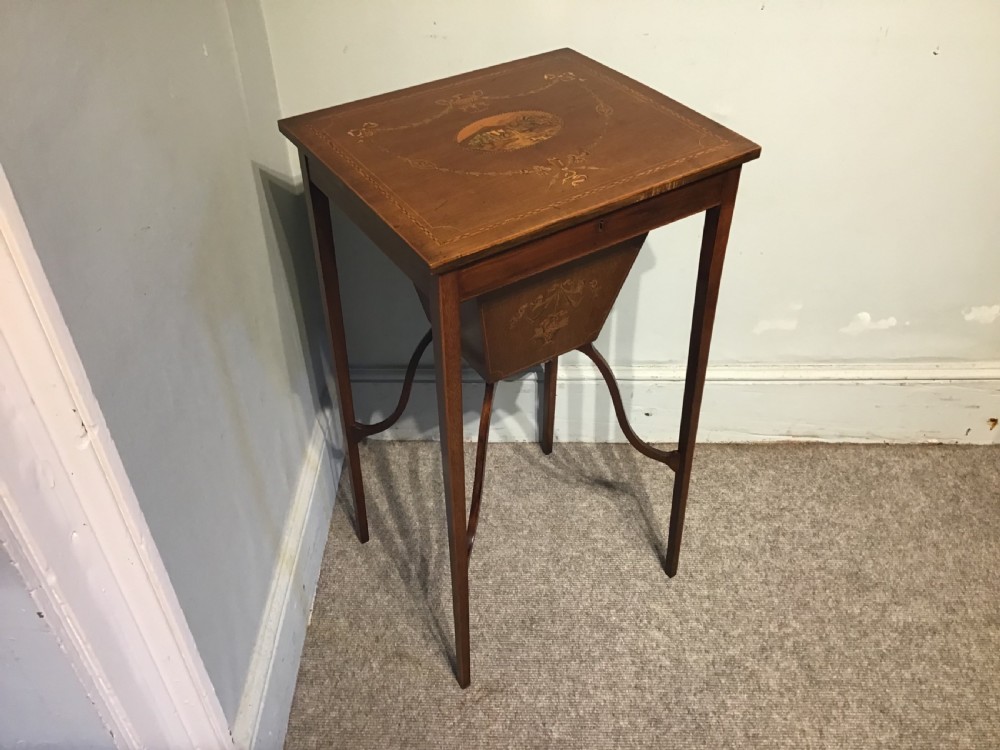 An antique inlaid mahogany work table View II