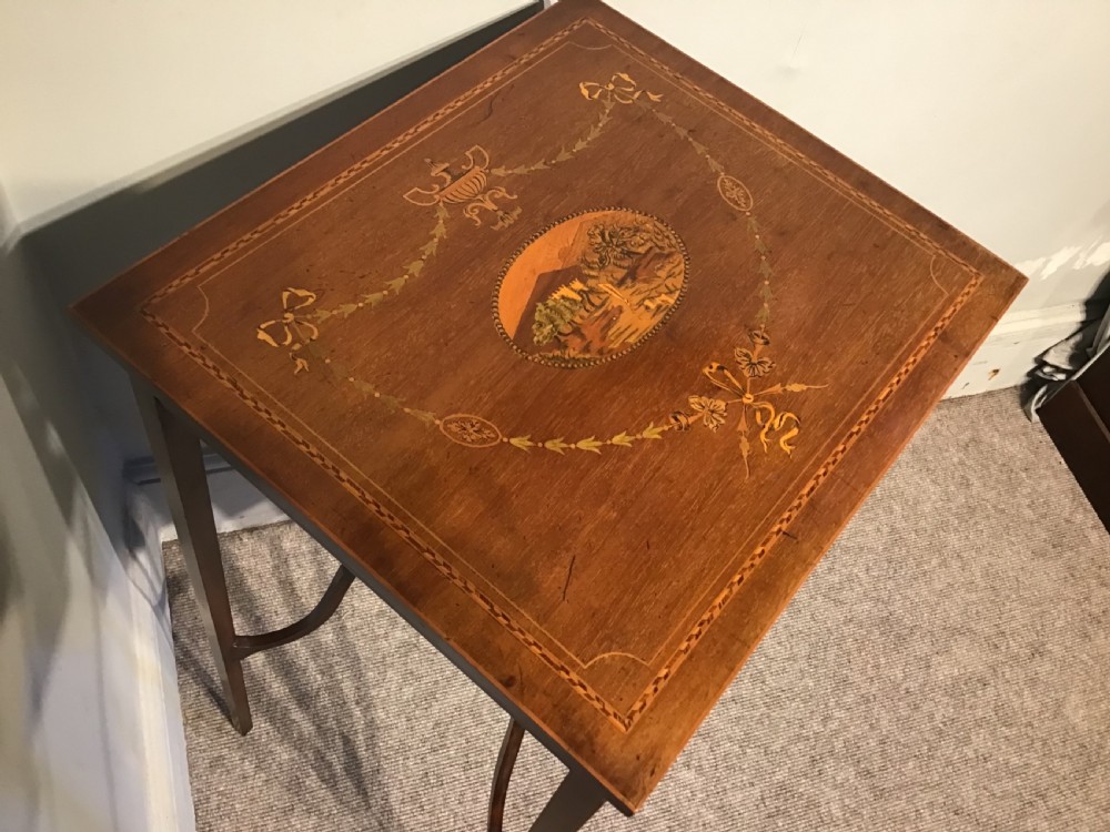 An antique inlaid mahogany work table View V