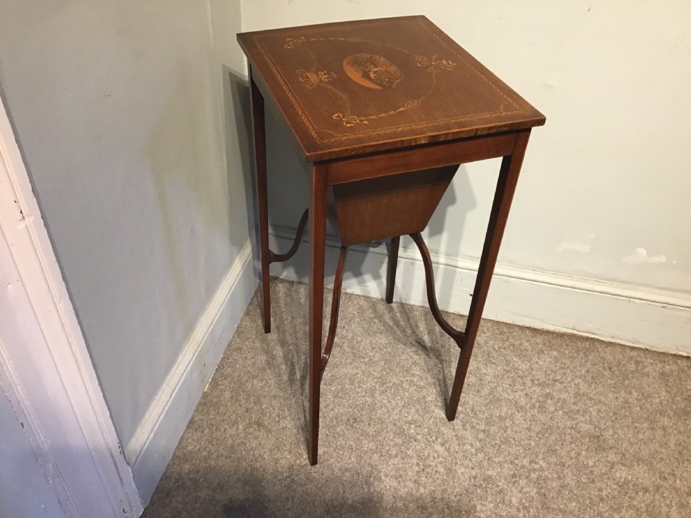 An antique inlaid mahogany work table View VII
