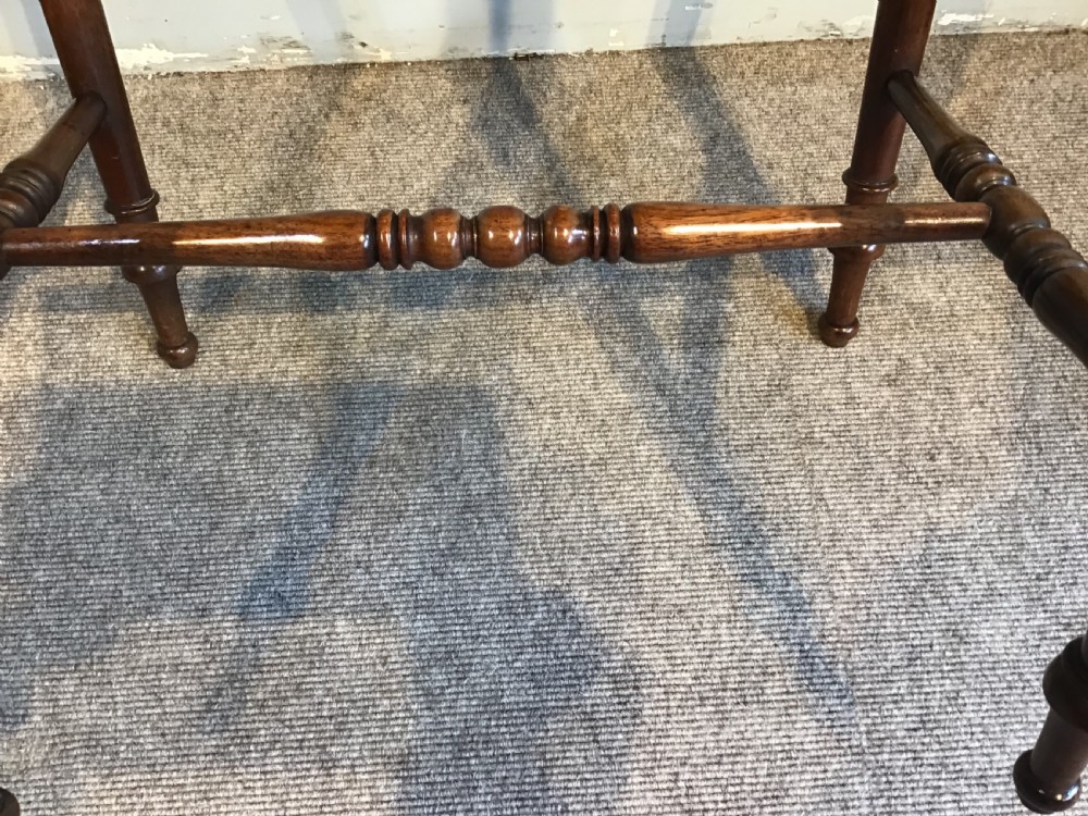 A Regency mahogany side table with a rectangular top, single drawer with brass pull, turned legs, and lower stretchers. View VII