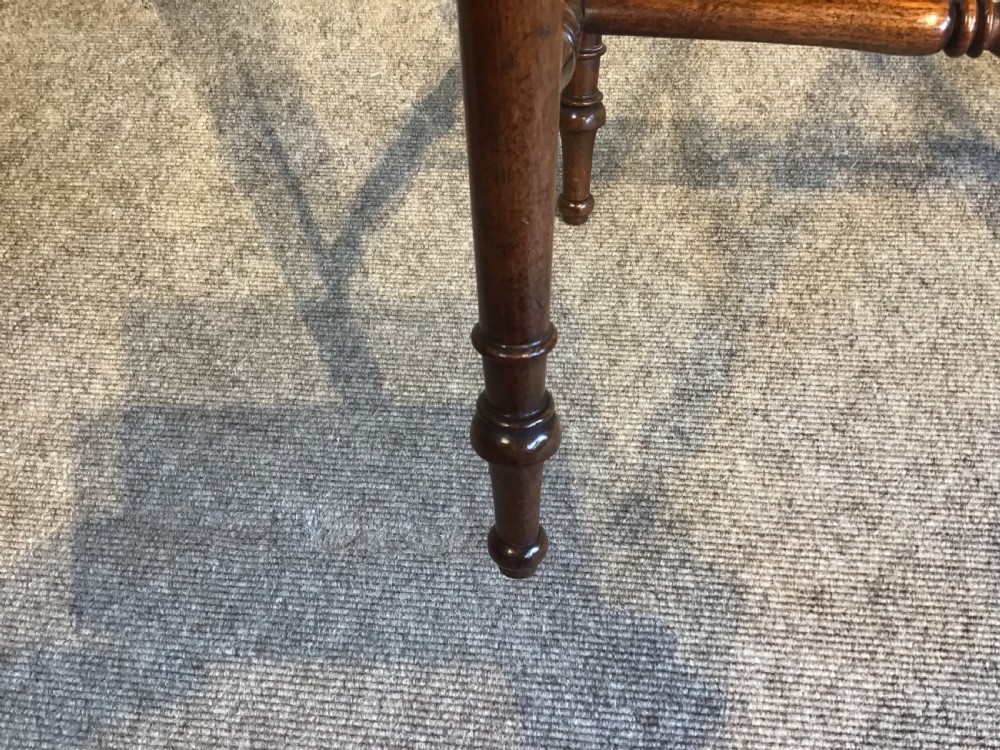 A Regency mahogany side table with a rectangular top, single drawer with brass pull, turned legs, and lower stretchers. View VIII