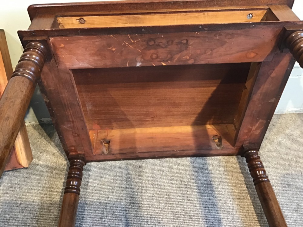 A Regency mahogany side table with a rectangular top, single drawer with brass pull, turned legs, and lower stretchers. View XI