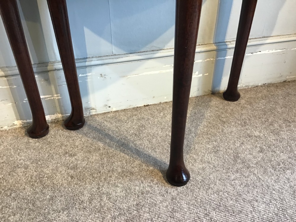 A Georgian mahogany semi-circular fold-over tea table featuring slender legs terminating in pad feet and a brass keyhole escutcheon. View IX
