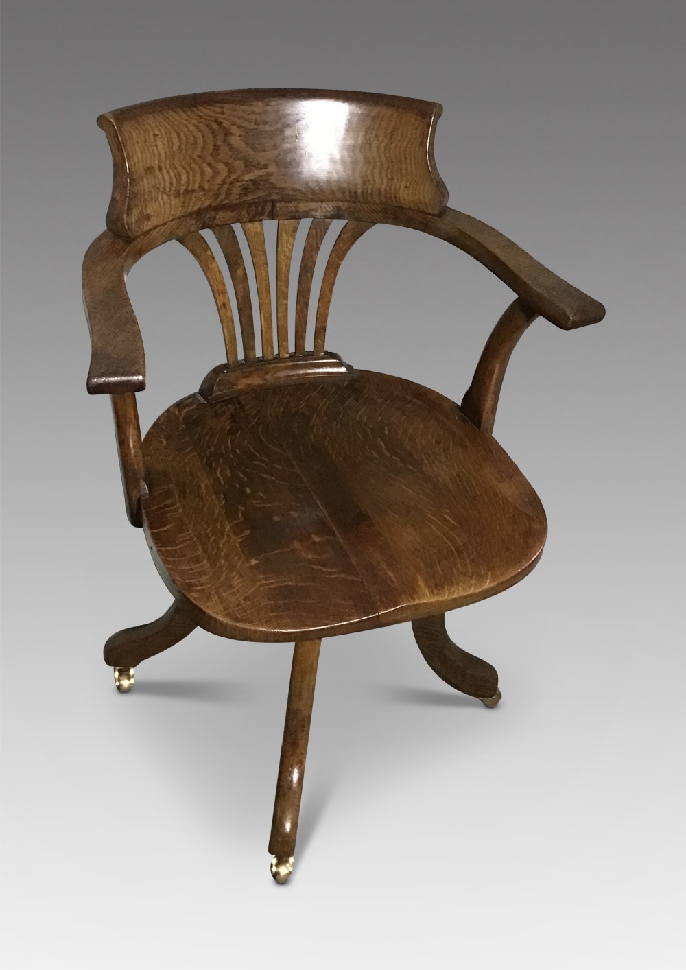 Antique oak revolving desk chair 