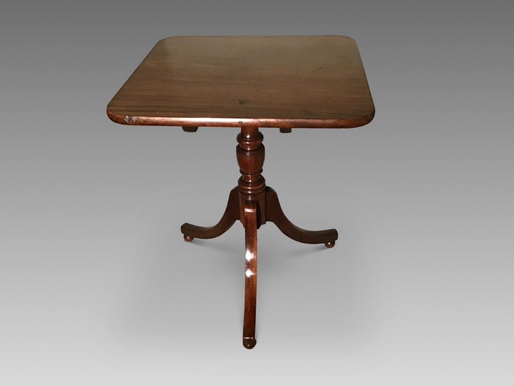A Georgian mahogany tripod table featuring a square top with rounded corners, supported by a turned central pedestal and three splayed legs. View II
