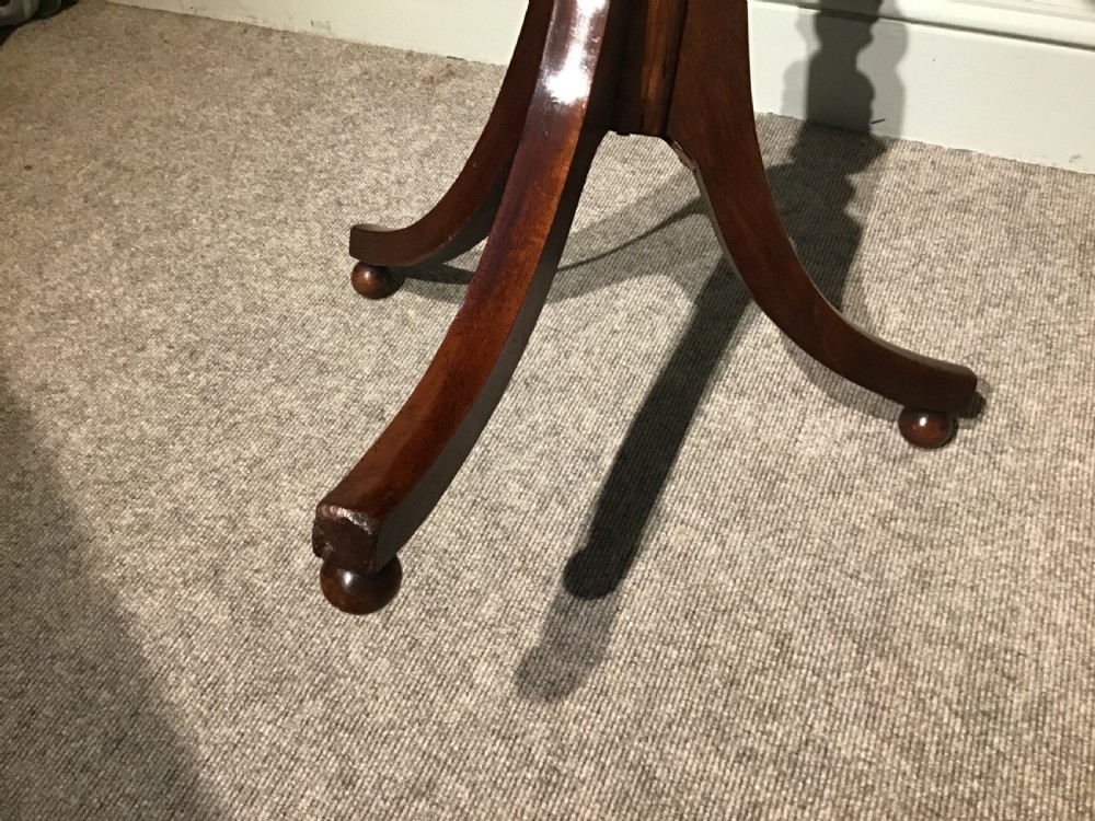 A Georgian mahogany tripod table featuring a square top with rounded corners, supported by a turned central pedestal and three splayed legs. View III