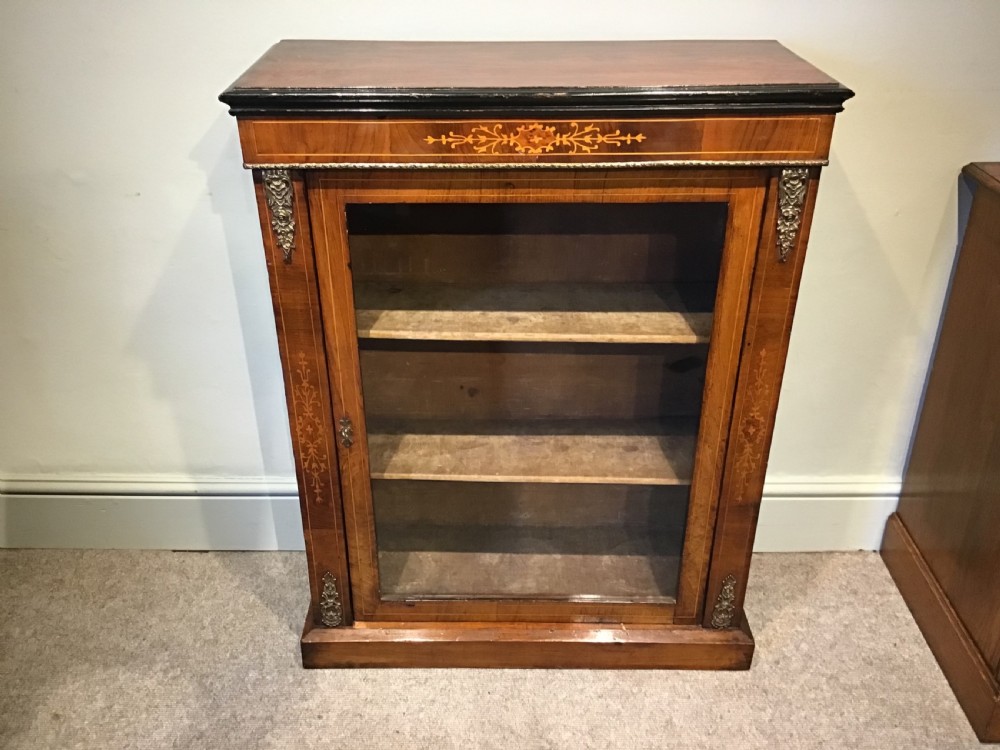 Victorian walnut pier cabinet with floral marquetry inlay, single glazed door, three internal shelves, and metal ormolu mounts. View II