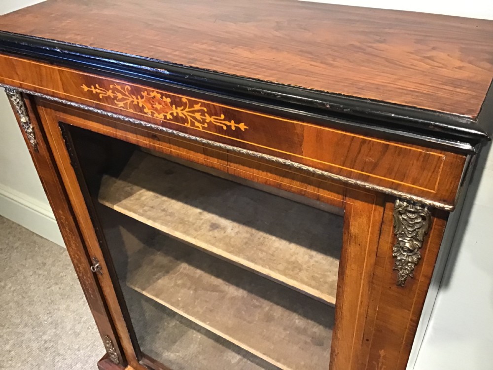 Victorian walnut pier cabinet with floral marquetry inlay, single glazed door, three internal shelves, and metal ormolu mounts. View III