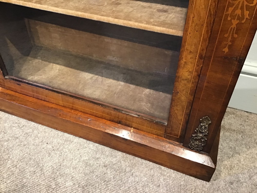 Victorian walnut pier cabinet with floral marquetry inlay, single glazed door, three internal shelves, and metal ormolu mounts. View VII