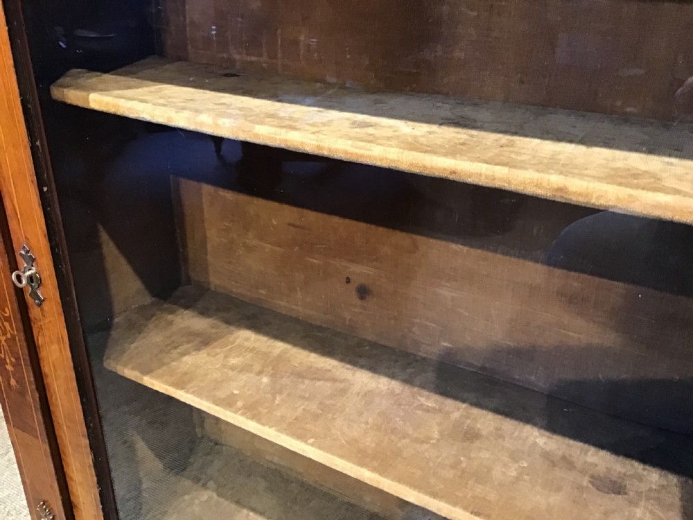 Victorian walnut pier cabinet with floral marquetry inlay, single glazed door, three internal shelves, and metal ormolu mounts. View IX