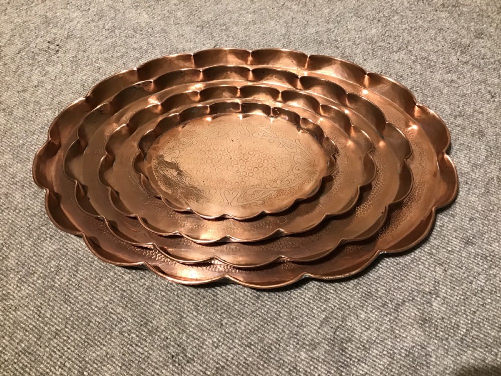 Set of four copper trays