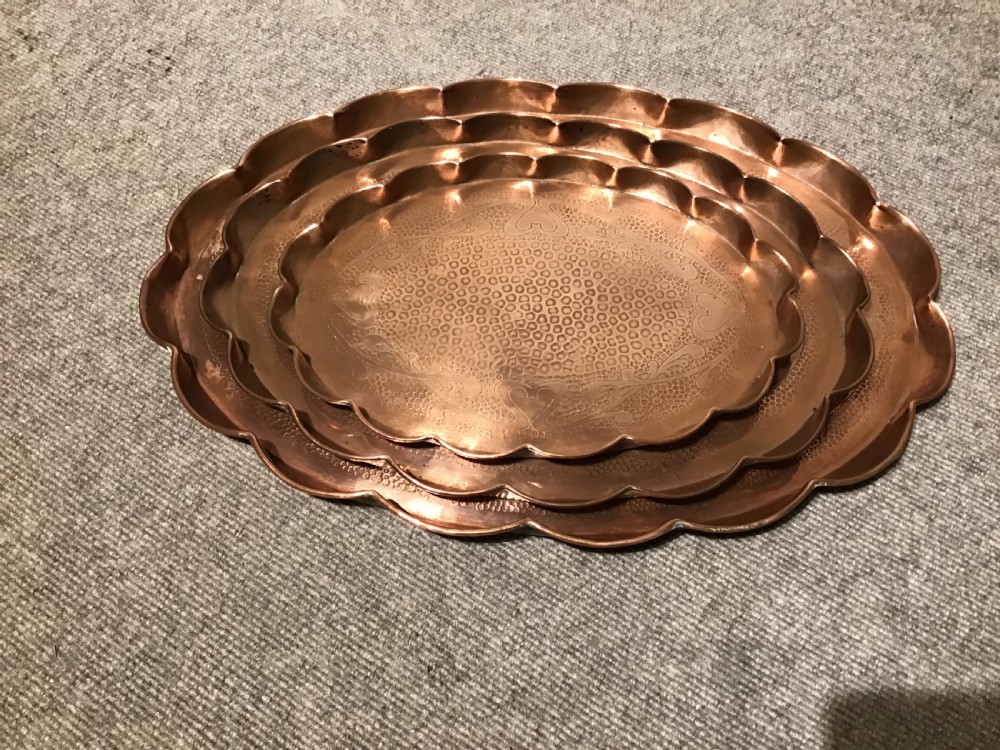 Set of four copper trays View II