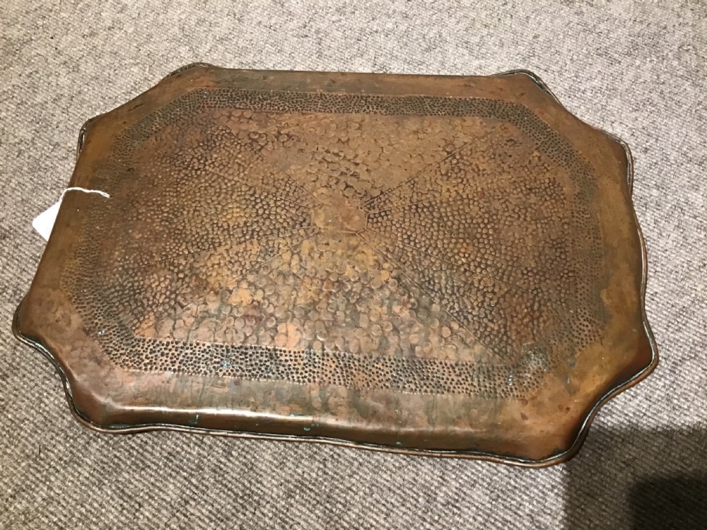 A rectangular Arts and Crafts hand-hammered copper tray featuring a raised scalloped rim and geometric textured surface patterns. View IV