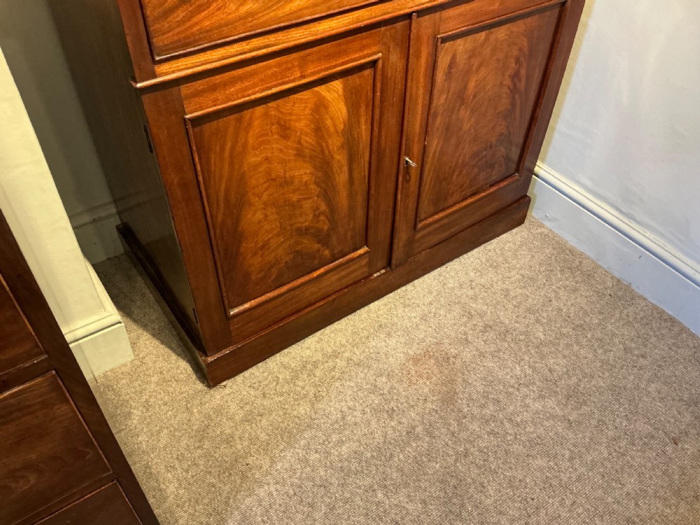 A Victorian mahogany secretaire bookcase featuring an upper glazed two-door cabinet, a central secretaire drawer with turned wooden handles, and a lower double-door cupboard. View VIII