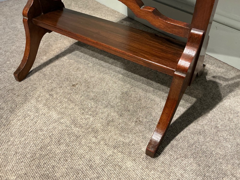 An Edwardian mahogany cheval mirror with a rectangular full-length tilting glass plate supported by two vertical upright posts on splayed legs. View VII