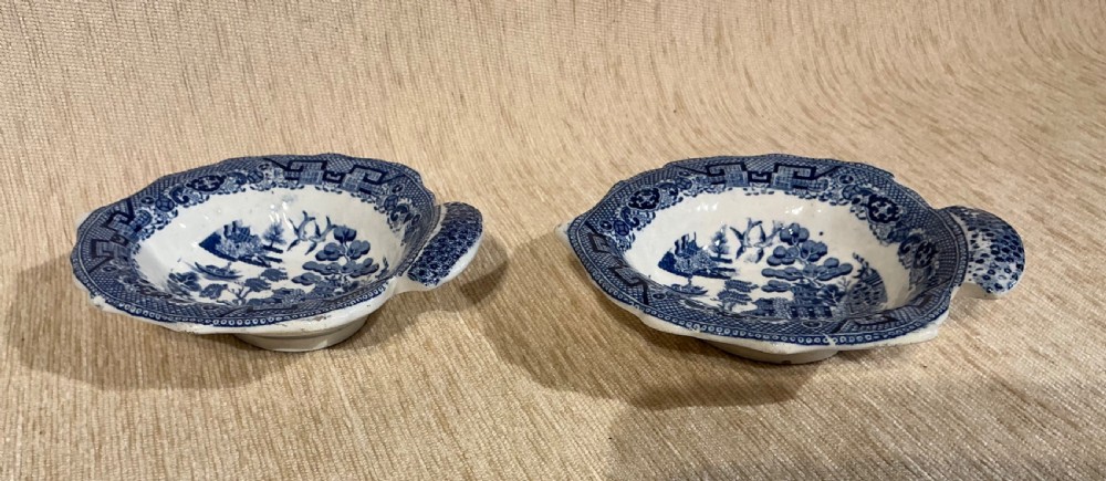 A pair of small, leaf-shaped blue and white ceramic pickle dishes decorated in the traditional Willow transferware pattern. View II