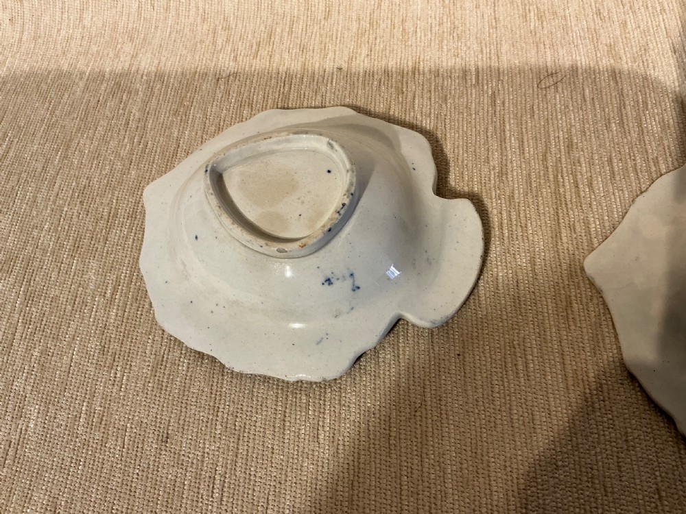 A pair of small, leaf-shaped blue and white ceramic pickle dishes decorated in the traditional Willow transferware pattern. View IV