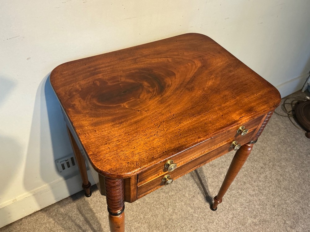 An early nineteenth-century mahogany and maple work table featuring two drawers with brass knobs, reeded upper corner detailing, and turned legs. View III