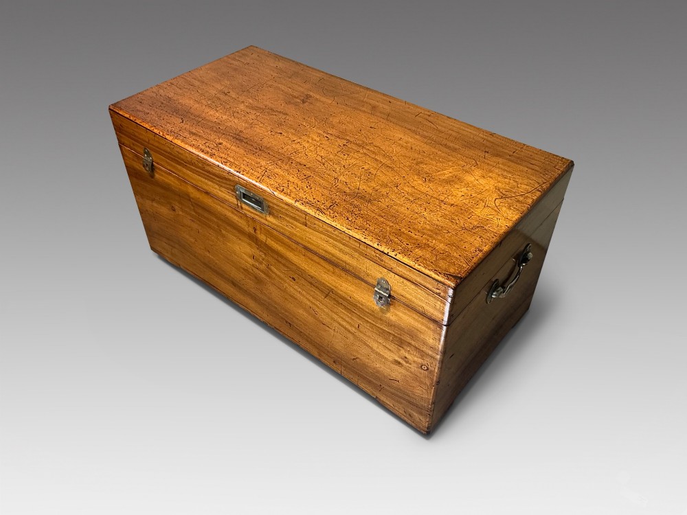 A rectangular antique camphorwood trunk with recessed metal handles and front latches. View II