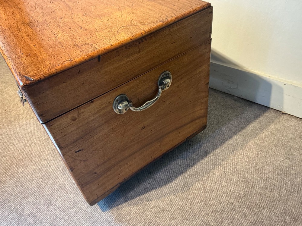 A rectangular antique camphorwood trunk with recessed metal handles and front latches. View III