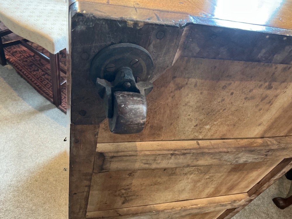 A rectangular antique camphorwood trunk with recessed metal handles and front latches. View VIII