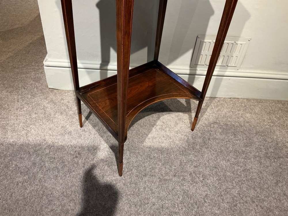 A late Georgian Sheraton mahogany work table featuring satinwood crossbanding, a single drawer, tapered square legs, and a concave lower undertier. View V