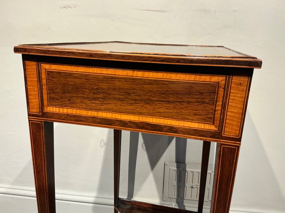A late Georgian Sheraton mahogany work table featuring satinwood crossbanding, a single drawer, tapered square legs, and a concave lower undertier. View VIII