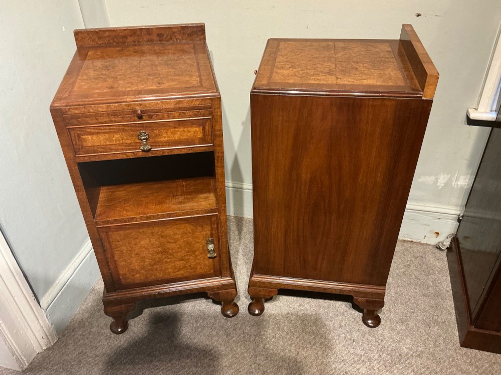 A matching pair of burr walnut bedside cabinets featuring pull-out slides, single drawers, open cubbies, lower cupboard doors, and cabriole legs. View VII