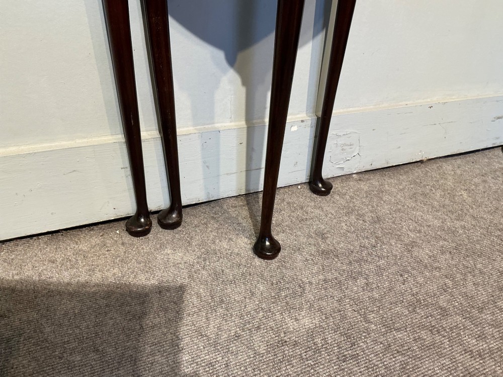 A dark mahogany demi-lune fold-over tea table with slender tapered legs, pad feet, and a brass keyhole escutcheon on the apron. View V