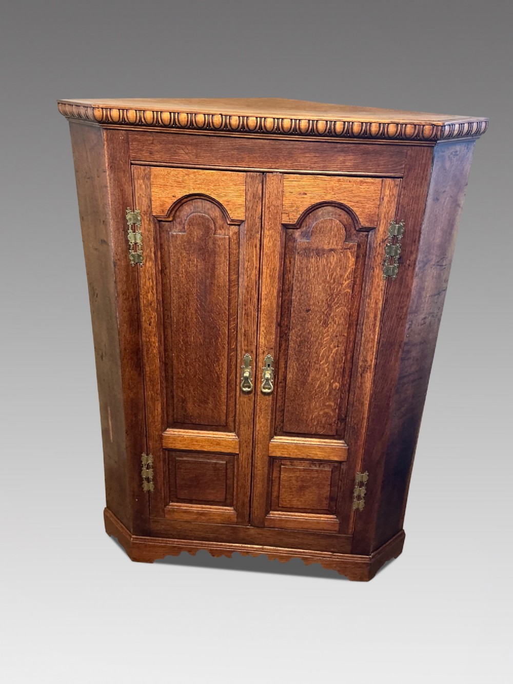 Antique oak floor standing corner cabinet