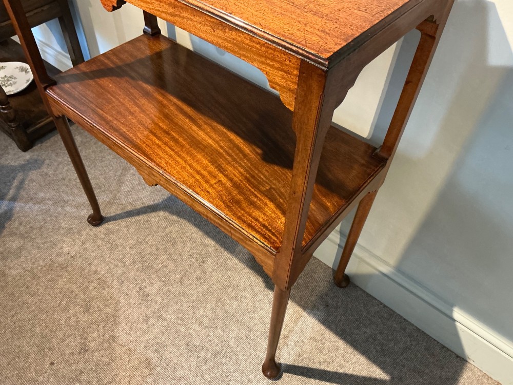 A rectangular mahogany two-tier occasional table with slender legs, pad feet, and shaped aprons. View IV