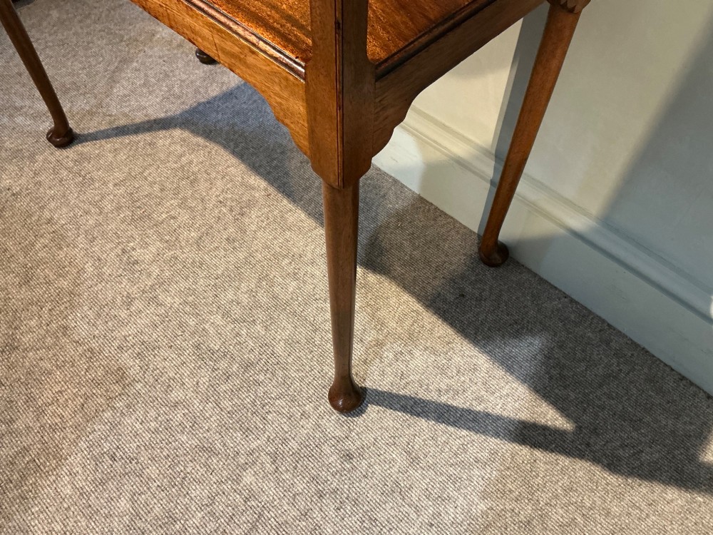 A rectangular mahogany two-tier occasional table with slender legs, pad feet, and shaped aprons. View V