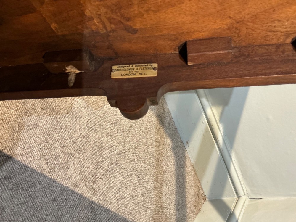 A rectangular mahogany two-tier occasional table with slender legs, pad feet, and shaped aprons. View VII