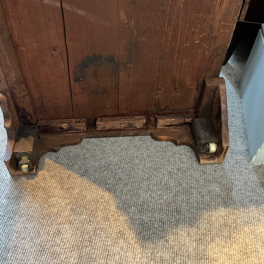 A Georgian cedar wood chest of drawers featuring multiple drawer compartments, brass swan-neck handles, and bracket feet. View IX