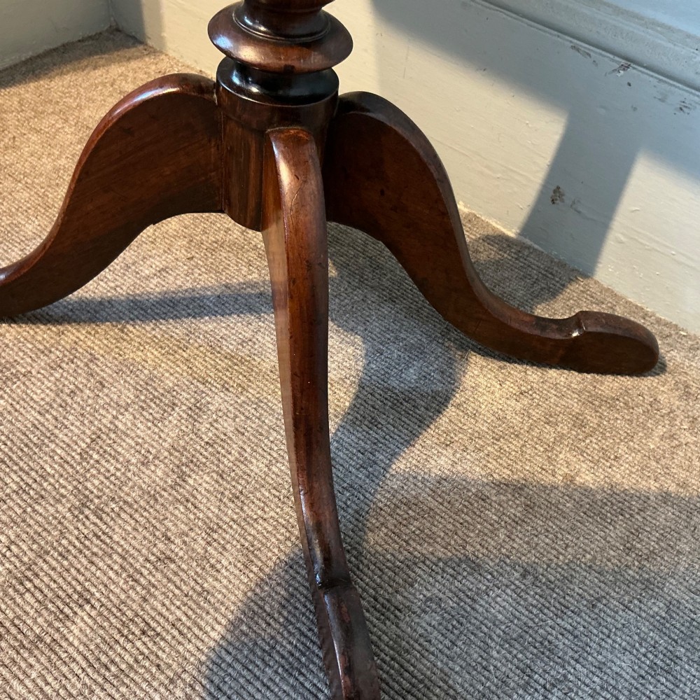 An antique dark wood pedestal chess table featuring an inlaid checkerboard surface top and a turned stem on four splayed legs. View VII