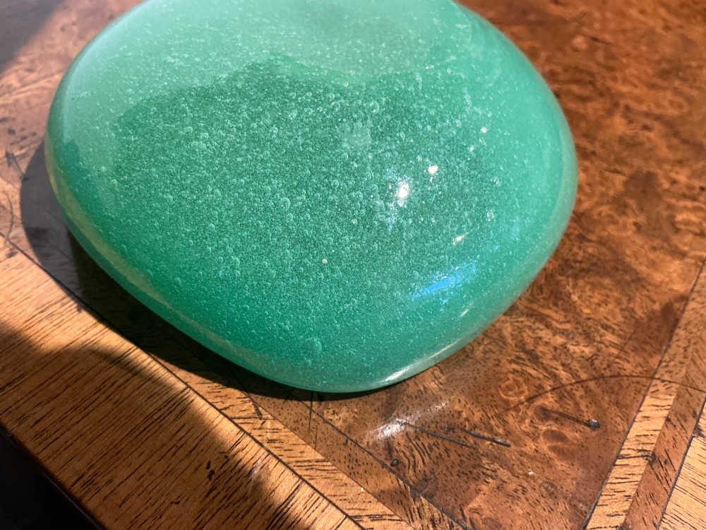 A rounded square green Murano glass dish with thick walls and visible internal micro-bubbles. View VI