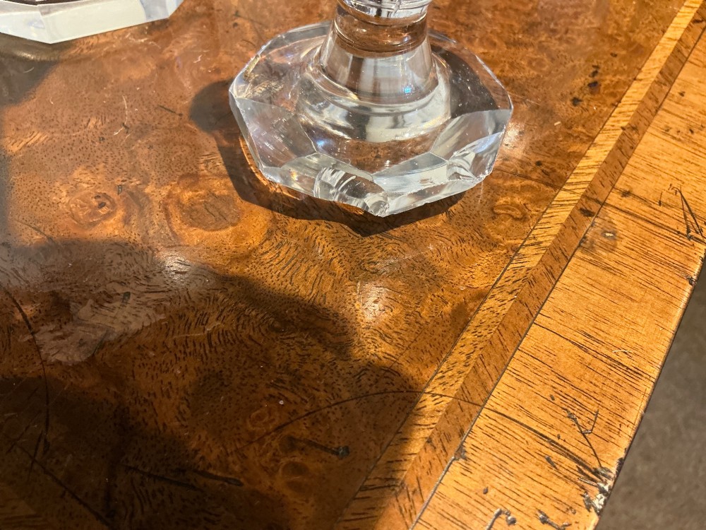 A set of four matching clear cut crystal liqueur decanters featuring panelled bodies and facet-cut stoppers. View VI